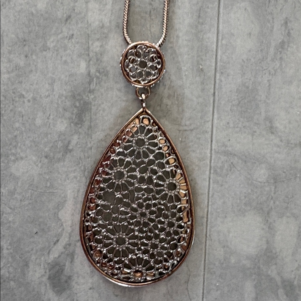 Handmade  floral cut out teardrop pendant necklace  silvertone/goldtone edge 36”